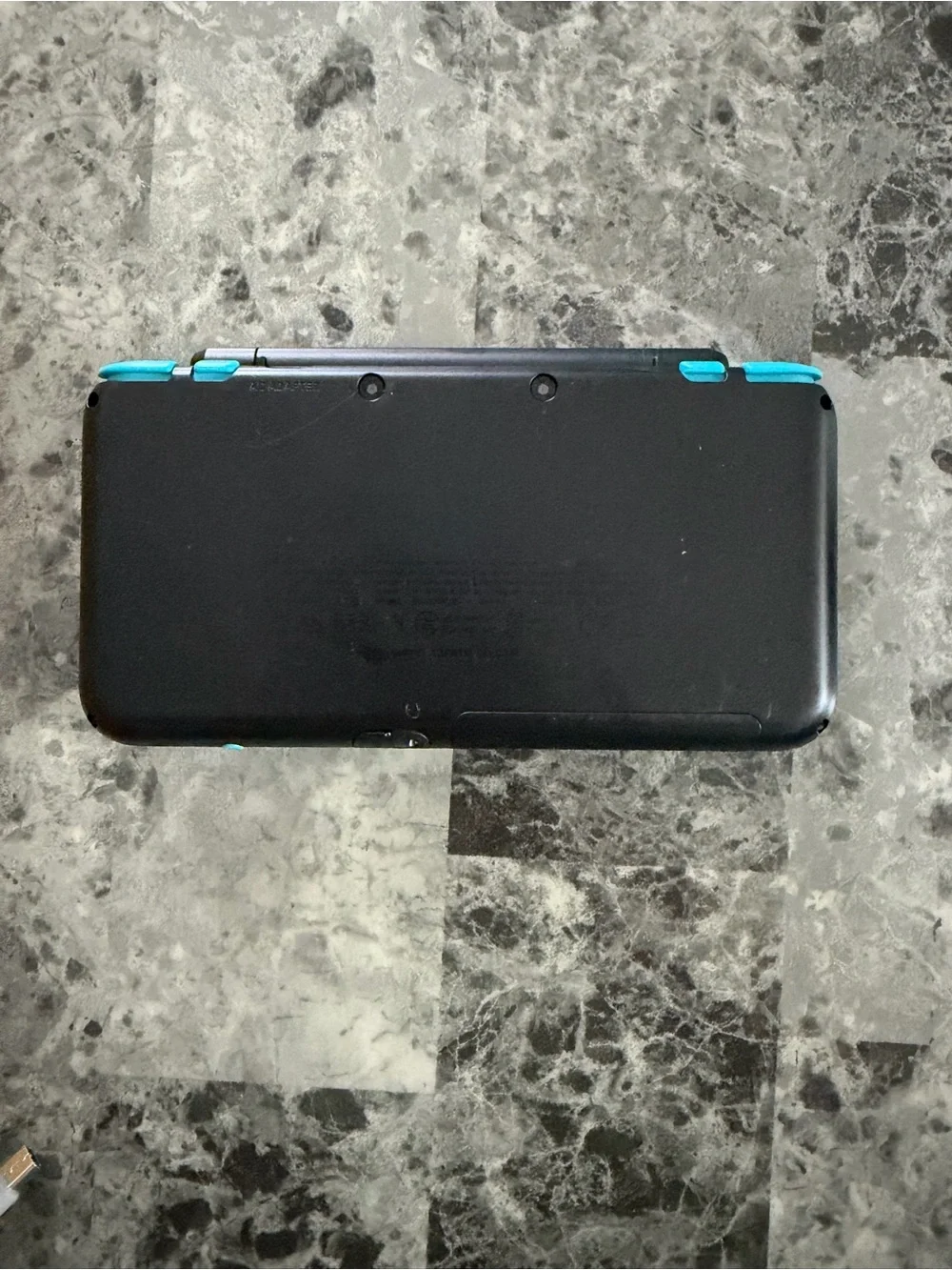 Nintendo Dual-Screen Handheld Console in Black with Teal Buttons
